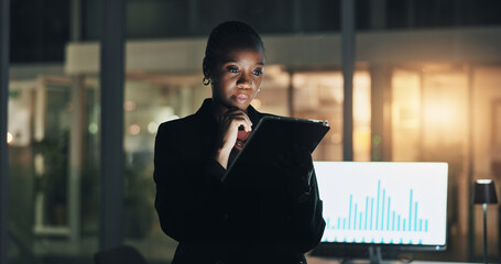 Black woman, tablet and night at office with finance, graphs and thinking for review with computer screen. African investor, broker and insight with tech, application or stats with charts at agency