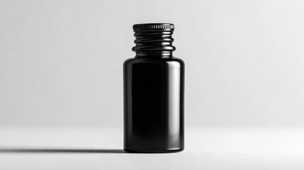 Sleek black bottle with classic design, ideal for perfume packaging, luxury skincare visuals, or minimalist product photography.