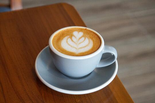 Cafe Latte with Oat Milk, Indonesia, captured on August 6, 2025. A warm oat milk latte served in a ceramic cup, creamy and smooth, perfect for a cozy caf&eacute; moment with natural light on a wooden table