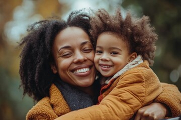 Obraz premium Cheerful disabled child with special needs sitting in a wheelchair, smiling and bonding with her mother outdoors. The image promotes inclusion, diversity, and the joy of family time, Generative AI