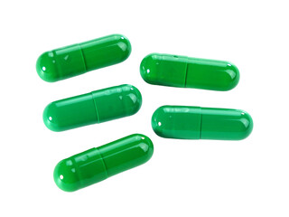 Bulk green capsule pills isolated on white background.