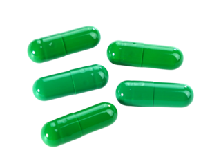 Bulk green capsule pills isolated on white background.