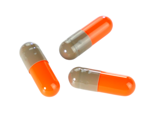 Bulk orange capsule pills isolated on white background.