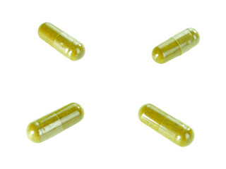 Bulk green herbal capsule pills isolated on white background.