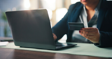 Online shopping, employee and hands with card, laptop or browsing for purchase on website in office. E commerce, credit and person with tech for payment, scroll and choice for discount or buying