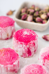 Homemade Chinese snow skin mooncakes. Snowy Moon cakes on a White Background. Mid-Autumn Festival, traditional Asian desserts, and seasonal celebrations in Asian countries