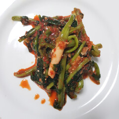 A close-up of a bowl of yeolmu kimchi, a savory and wholesome Korean side dish.
