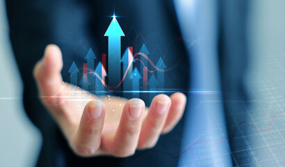 Business man showing holographic graphs and stock market statistics gain profits. concept of growth planning and business strategy. business stock market investment graph growth.
