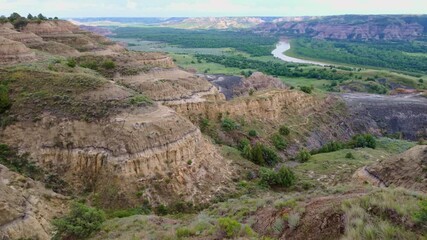 A sweeping panoramic view from the River Bend Overlook Trail in Theodore Roosevelt National Park captures the majestic Missouri vista