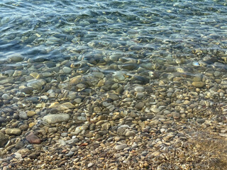 Clear sea and pebble beach.