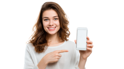 Smiling young woman pointing at a blank smartphone screen on an isolated background.