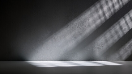 Close-up of soft gray surface with natural light shadow patterns. Elegant and clean background.