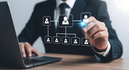 Business professional drawing an organizational chart with digital icons