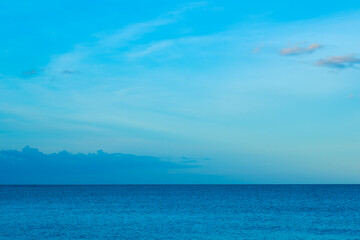 Nature of the ocean and blue sky Summer with sunshine, sandy beaches, clear blue waters sparkling against the blue sky. on an island with good ecology and environment Background for summer vacation