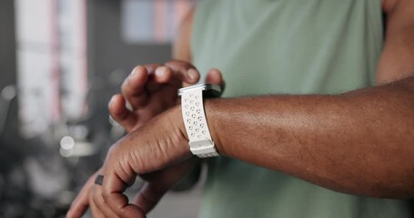 Man, hands and check fitness on smart watch at gym for workout data, health app and track progress. Athlete, person and timer at sports club for exercise performance, training results and heart rate