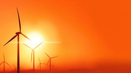 Fototapeta premium Wind turbines silhouetted against a vibrant sunset, symbolizing renewable energy and nature's beauty