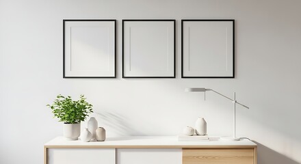 Modern interior with three blank frames on white wall