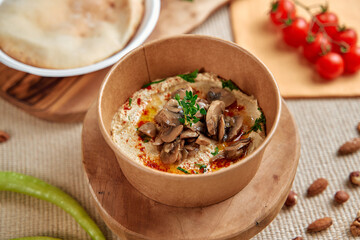Delicious and Nutritious Hummus Topped with Savory Mushrooms, Fresh Herbs, and Drizzled with Olive Oil, Perfect for Dips and Spreads