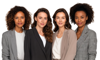 Diverse group of four confident businesswomen in blazers, standing together and looking at the camera, isolated on transparent background