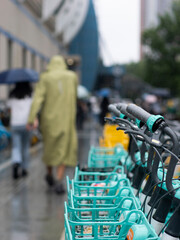Obraz premium Commuters at subway station during heavy rain