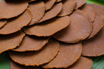Fermented soybean discs, known as “Thua Nao,” a traditional Thai seasoning used to enhance flavor in Northern cuisine.