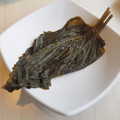 A close-up of a perilla leaf pickle (kkaetnip-jangajji), a savory and wholesome Korean side dish.