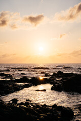 Stunning Sunset Over the Ocean at Tenerife Island With Rocky Shoreline