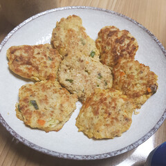 A close-up of a plate of various Korean savory pancakes (jeon), a wholesome and delicious side dish.