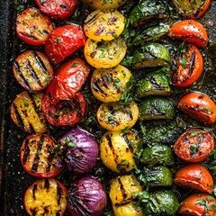 Assorted colorful grilled cherry tomatoes on a baking sheet with herbs and oil, ready for roasting or serving fresh, vibrant vegetarian dish for healthy eating