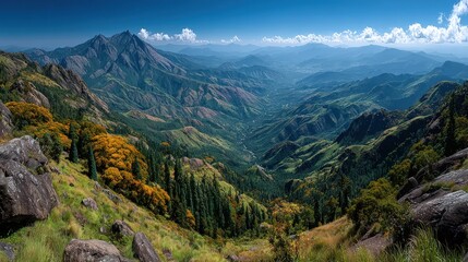 Obraz premium Panoramic mountain valley view, vibrant autumn colors, rugged peaks, lush greenery