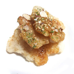 A close-up of a plate of sweet and sour fried pork (tangsuyuk), a popular Korean Chinese dish.

