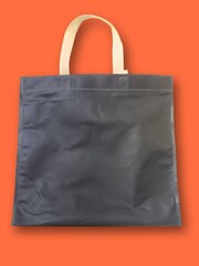 Shopping bag on orange