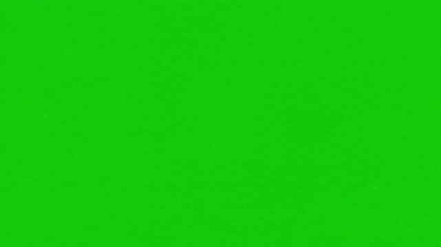 A vibrant explosion of colorful powder in blue, yellow, purple, and orange. This effect is on a green screen, ideal for chroma key compositing in celebrations, festivals, or creative video projects.