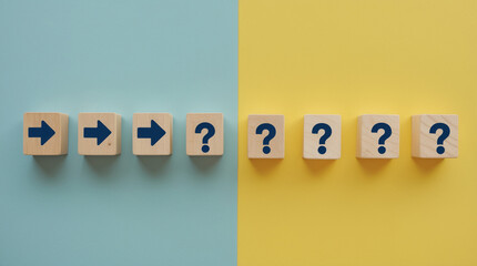 Wooden cubes with directional arrows and question marks blue yellow