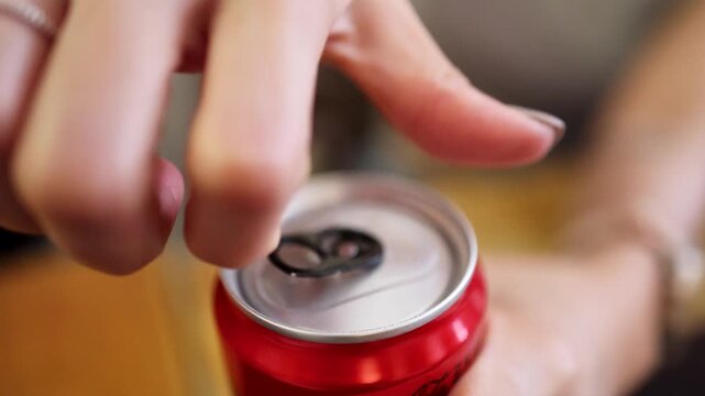 Hand Opening Red Aluminum Beverage Can Close-Up Sequence