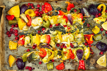 Fish skewers on a BBQ, overhead view.