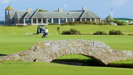 Golfers Crossing Historic Stone Bridge at St Andrews Course - Powered by Adobe