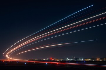 Airplane light trails taking off at night from airport runway