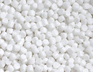 Close-up of numerous small, uniformly-sized white pellets