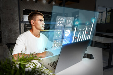 Young man focused on financial analysis using modern technology in an office setting during the day