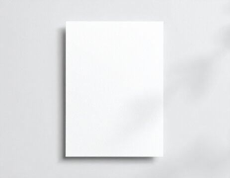 Blank white vertical paper sheet 5x7 inches with shadow overlay. Modern and stylish greeting card or wedding invitation mock up.