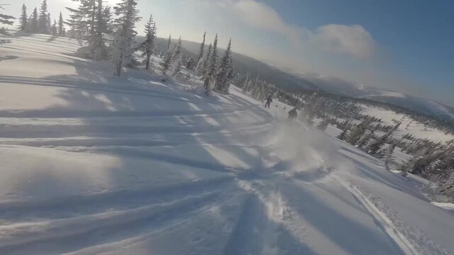 Drone transitions from skier pursuit to expansive mountain panorama
