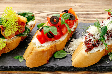 bruschetta with tomatoes, olives and basil