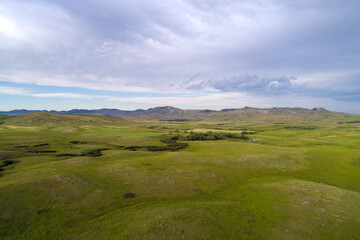 Obraz premium The Rolling green hills of Montana and Wyoming