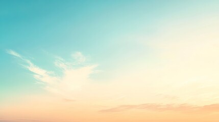 Fototapeta premium Soft pastel sunset sky with wispy clouds.