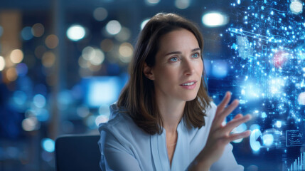 A woman interacts with digital data in a modern office, showcasing technology and innovation in a professional environment.