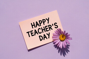 Happy Teacher's Day Card with Purple Flower on Lilac Surface for Greeting, Appreciation, Classroom or Celebration Design