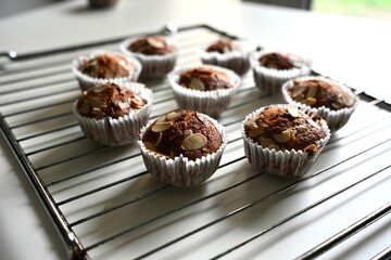 Freshly Baked Almond Muffins Cooling on a Wire Rack