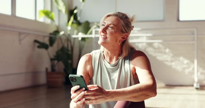 Fitness, smartphone and old woman in studio, smile and track progress with wellness. Pensioner, cellphone and mature person with internet, exercise and digital app with connection, funny and break