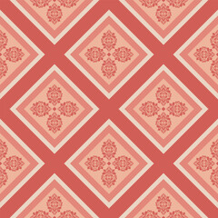 A geometric pattern of decorative squares, filled with floral designs, repeating across the image. The colors are a soft and warm palette of reds and oranges.